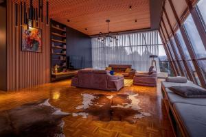 a living room with two couches and a large window at Luxurious Villa in Prevalla in Prevallë