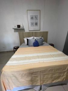 a large wooden bed in a room with at Brisas del Mar in La Libertad