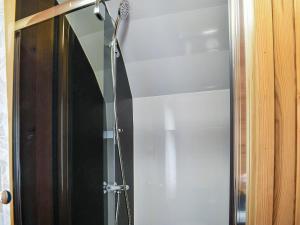 a glass shower door with a shower head at Barn Scar-uk1394 in Corney