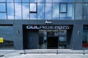 a large glass building with a glutamate express sign on it at Luxurious Downtown Apartment 143 in Istanbul