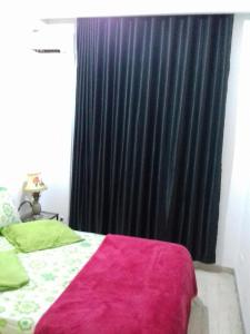 Appartement meublé centre ville de Tunis tesisinde bir odada yatak veya yataklar