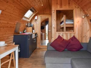 a living room with a couch in a tiny house at Selker View-uk1397 in Corney