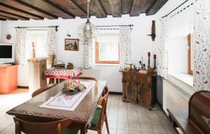 a kitchen with a table and chairs and a dining room at Ferienhaus In Idylle St, Peter in Inneraigen
