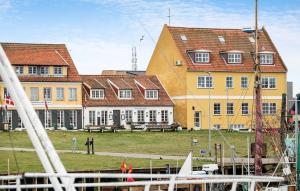 a group of buildings with a marina in front at 1 Bedroom Cozy Apartment In Gilleleje in Gilleleje