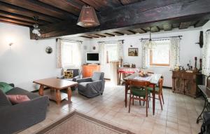 a living room with a table and a dining room at Beautiful Home In Aspangberg - St,peter With Kitchenette 