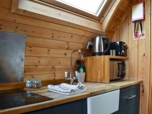 a kitchen with a sink and aaucet in a tiny house at Withy Bottom-uk1393 in Corney