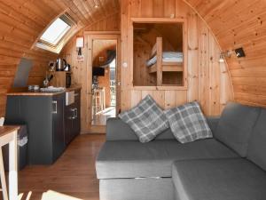 a living room with a couch in a tiny house at Stainton-uk1395 in Corney