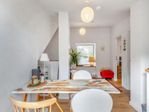 a dining room with a table and chairs at Earthspring Flat in Totnes