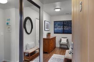 a bathroom with a mirror and a chair and a dresser at Mammoth Rock Oasis Villa-Hot Tub & Free Pets in Sedona