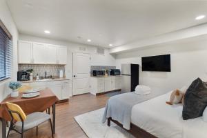 a living room with a bed and a kitchen at Mammoth Rock Oasis Villa-Hot Tub & Free Pets in Sedona