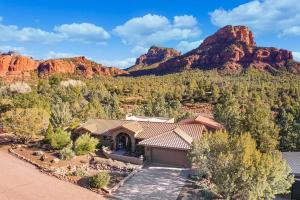 an aerial view of a house with mountains in the background at Mammoth Rock Oasis Villa-Hot Tub & Free Pets in Sedona