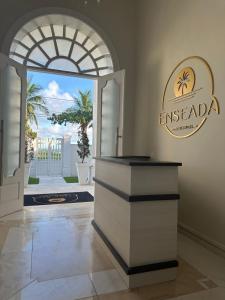 a lobby with an entry way with an entry door to anacienda at Enseada Premium Suítes in Guarujá
