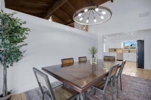 a dining room with a wooden table and chairs at HUGE Golf course Family home-FREE Heated Pool-Theater-Gym in Tempe