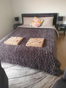 a large bed with two pillows on top of it at Tranquil Studio Apartment Just 3km from Port Pirie in Port Pirie