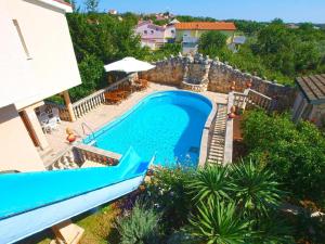 an aerial view of a swimming pool in a villa at Ferienwohnung für 4 Personen ca 55 qm in Ližnjan, Istrien Südküste von Istrien in Ližnjan
