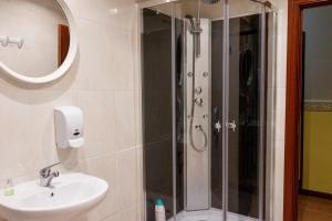 a bathroom with a shower and a sink at Pension Teresa in Calahorra