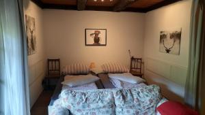 a room with two beds in a room at Ferienwohnung in Horben mit Großem Garten in Horben