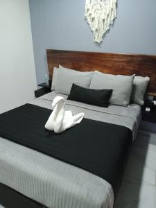 Postel nebo postele na pokoji v ubytování HOTEL PALENQUE PREMIER