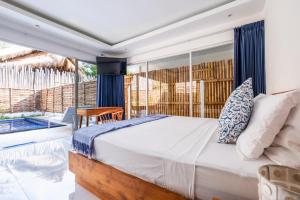 Postel nebo postele na pokoji v ubytování Seri Resort Gili Meno - Adults Only