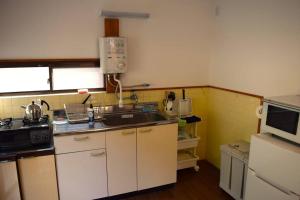 A kitchen or kitchenette at Komorebi/こもれび