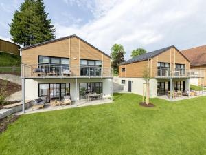 an exterior view of a house with a yard at STAY4 3 Modern retreat in Wunsiedel