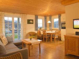 a living room with a couch and a table at 2 in Alpenrösle Modern retreat in Balderschwang