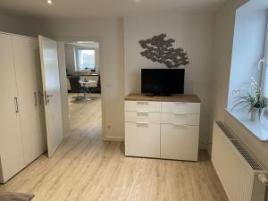 a living room with a tv on a counter at This year with lake view in Pönitz am See