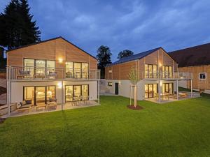 a large house with a large yard with green grass at STAY4 2 Modern retreat in Wunsiedel