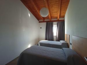 Postel nebo postele na pokoji v ubytování B&B Tra Gli Ulivi