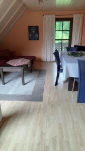 a living room with a table and chairs and a tableablish at Ferienwohnung in Horben mit Großem Garten - b48495 in Horben