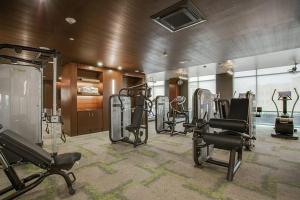 a fitness room with several treadmills and exercise bikes at Casa Catherine in Austin