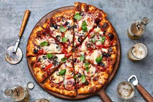 a pizza sitting on top of a table at Noble House Patong in Patong Beach