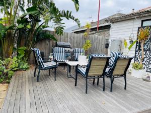 a patio with a table and chairs on a deck at D103 Lemon Tree House in Melbourne