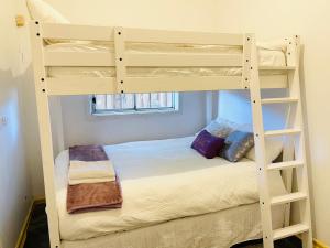 a bedroom with two bunk beds in a room at D103 Lemon Tree House in Melbourne