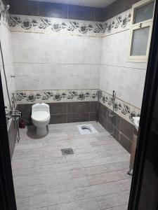 a bathroom with a toilet and a sink at سفانه in Unayzah +9 photos
