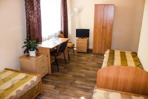 Rúm í herbergi á Mini-Hotel na Naberezhnoy
