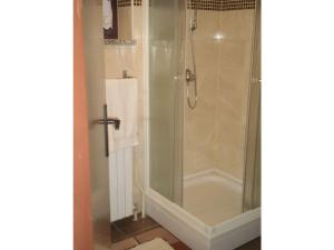 a shower with a glass door in a bathroom at Licul Modern retreat in Kukci +14 photos