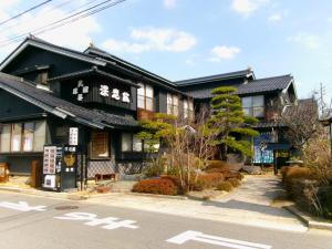 a building on the side of the street at Fukashiso in Matsumoto