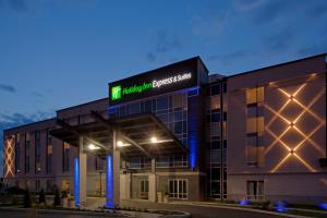 a building with a sign on top of it at Holiday Inn Express Hotel & Suites Saint - Hyacinthe, an IHG Hotel in Saint-Hyacinthe