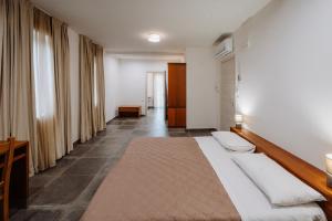 a bedroom with a large bed in a room at Nidi Apartments in Foggia