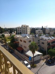 an aerial view of a city with buildings at سهول الكرمل للشقق الفندقية in Amman