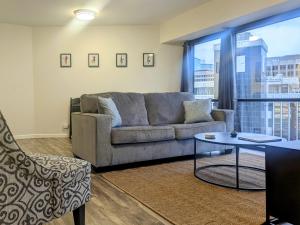 a living room with a couch and a table at Modern 1Bdrm Oceanview with Parking in Honolulu