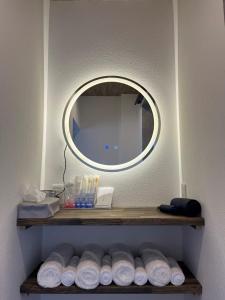 a bathroom with a mirror and a shelf with towels at KiCHi - Vacation STAY 15503 in Awaji
