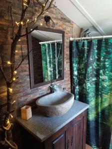 a bathroom with a sink and a mirror at Casa da Volta - Alentejo - S. Julião in Portalegre
