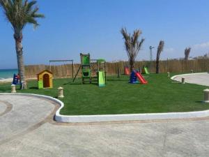 a park with a playground with a play equipment at Studio S0 FOLLA RESORT CHATT MERIEM in Sousse