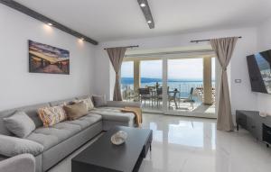 a living room with a couch and a table at Apartman 2A in Breza