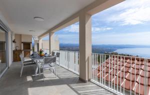 a balcony with a table and a view of the water at Apartman 2A in Breza +6 photos