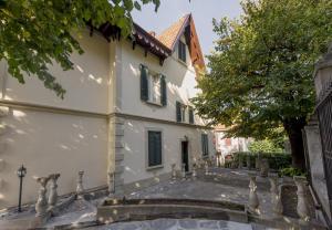 a house with a staircase leading up to it at Villa Puccini Bed & Breakfast in Lecco +34 photos