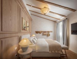 a bedroom with a bed and a table with a lamp at Saints Hills Cantina in Višnjan +64 photos