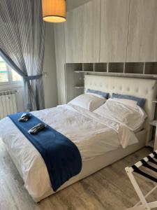 A bed or beds in a room at La Casa di Gio Golf Tennis e parcheggio privato